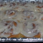 Pan of cinnamon rolls with white cream cheese icing