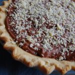 pie with chocolate filling and white chocolate shaved on top