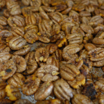 brown and toasty pecans on a pan