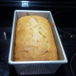brown bread in gray metal pan